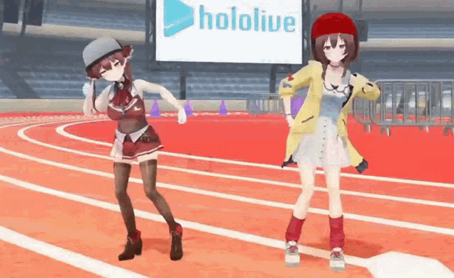 two anime girls are dancing on a track with a hololive sign in the background