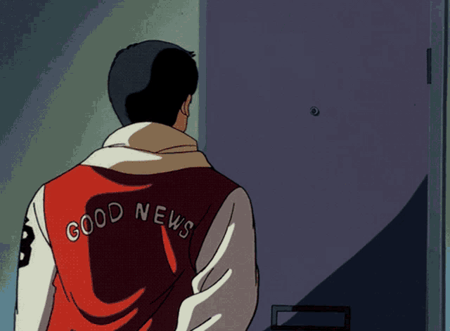a man wearing a red and white jacket that says good news