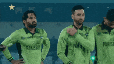 a group of men wearing green shirts with pakistan on them