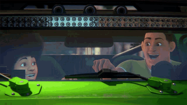 a man is driving a green car with a boy in the back