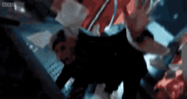 a blurry picture of a person with bbc written on the bottom right