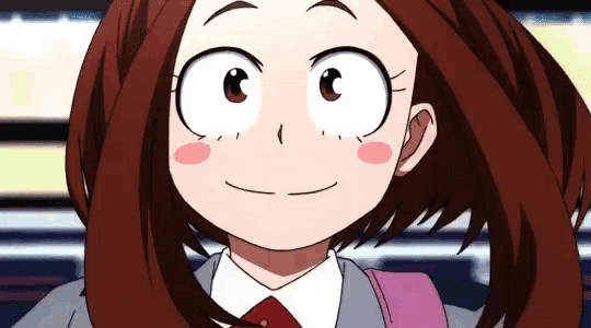 a close up of a girl 's face with a big smile .