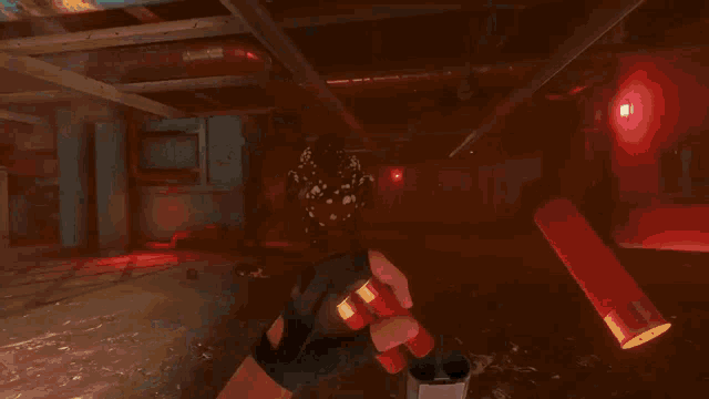 a video game is being played and a spider is being killed by a gun
