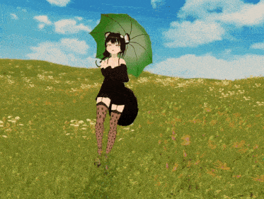 a girl in a black dress holding a green umbrella in a field