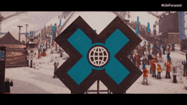 a large x with a globe on it is in the snow