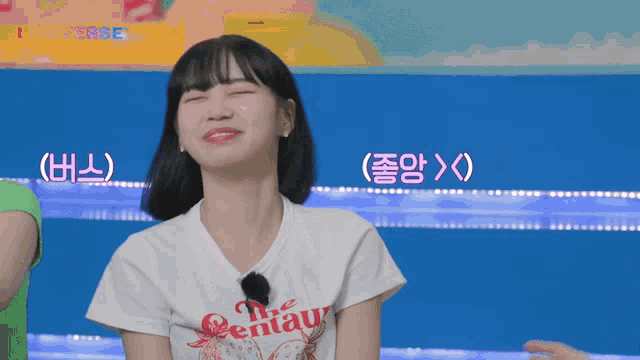 a girl wearing a white t-shirt that says the centaur on it
