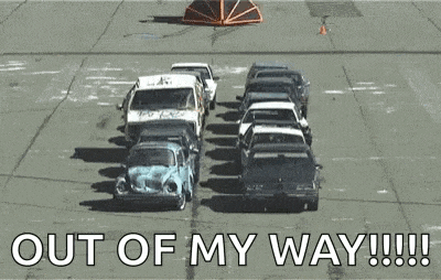 a bunch of cars are lined up in a parking lot with the words `` out of my way !!! ''