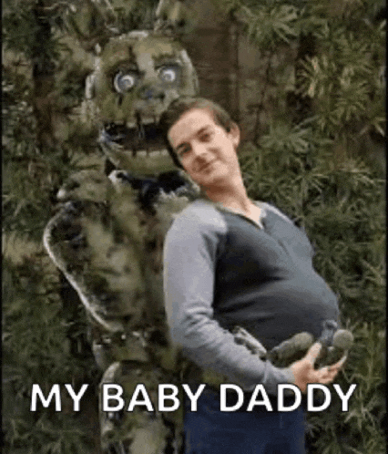 a pregnant man is standing next to a costume of a springtrap .