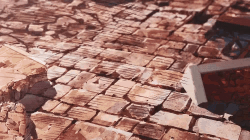 a close up of a cracked brick wall