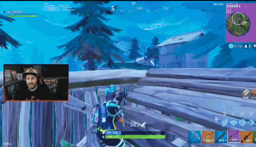 a man is playing a video game with the number 389 on his back