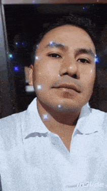 a man in a white shirt is taking a selfie with inslide written on the bottom right