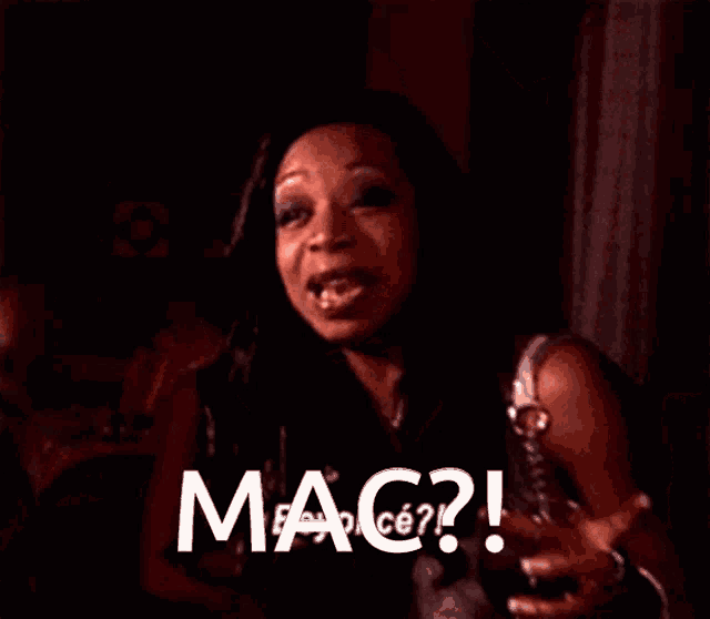 a close up of a woman 's face with the words mac on the bottom