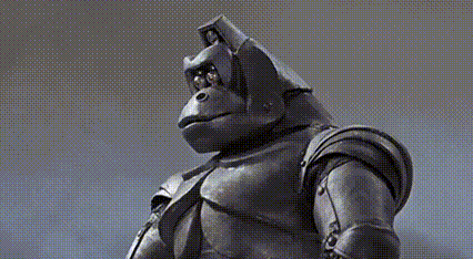 a statue of a gorilla with a helmet on its head .