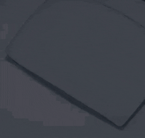 a person laying on a bed in a dark room with arrows on the wall