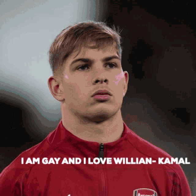 a young man wearing a red jacket with the words `` i am gay and i love willian-kamal '' written on it