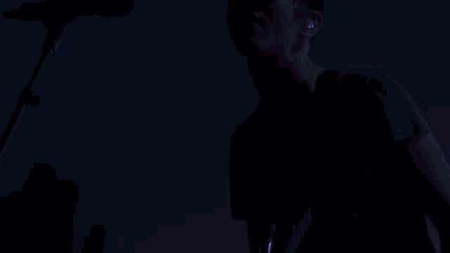a red light is shining on a black background
