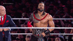 a man in a wrestling ring with a w belt