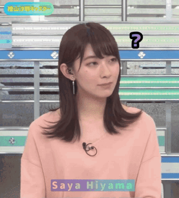 a woman in a pink shirt with the name saya hiyama