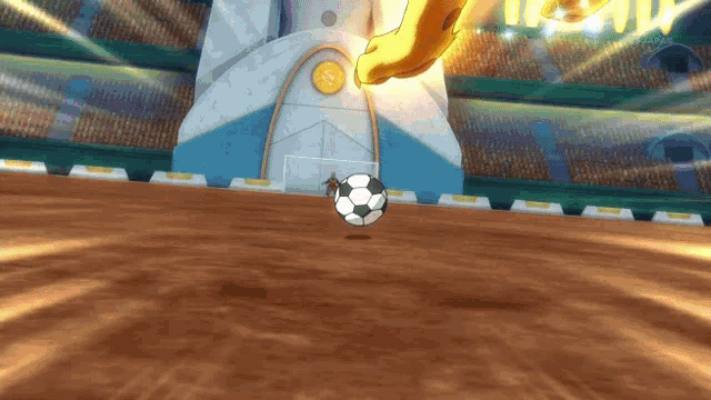 a soccer ball is being kicked by a person in a game
