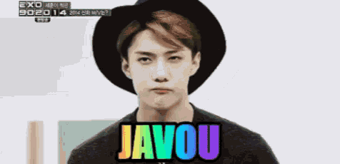 a young man wearing a hat says javou in rainbow colors