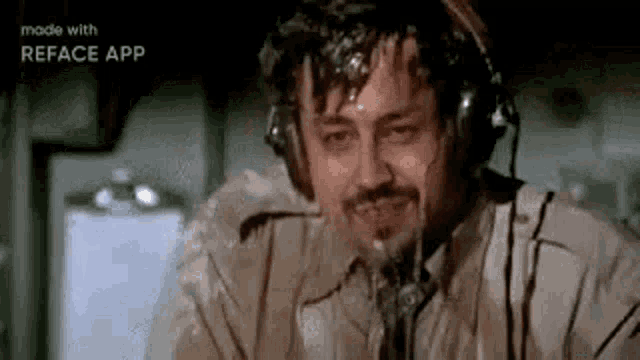 a man is wearing headphones and sweating while sitting in an airplane .