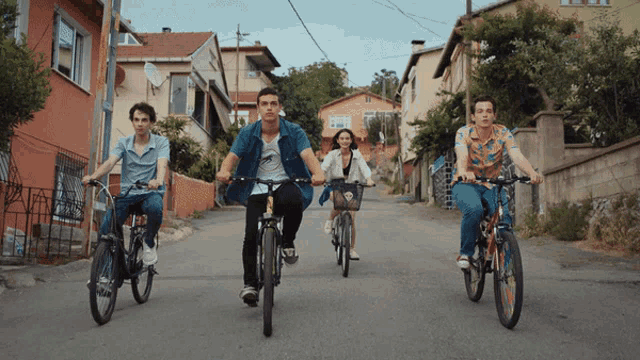 a group of people riding bikes down a street