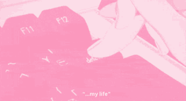 a pink keyboard with the keys f11 f12 and y on it