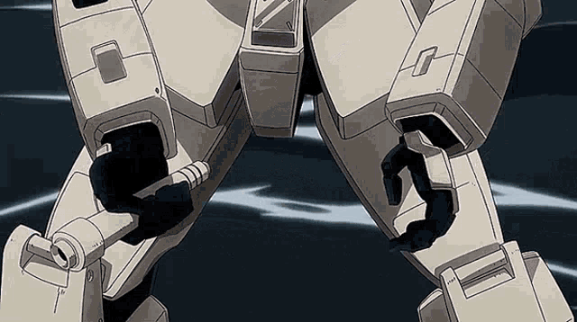 a close up of a robot 's legs and arms with a black background .
