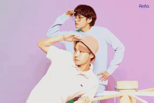 two boys standing next to each other with the word festa on the bottom left