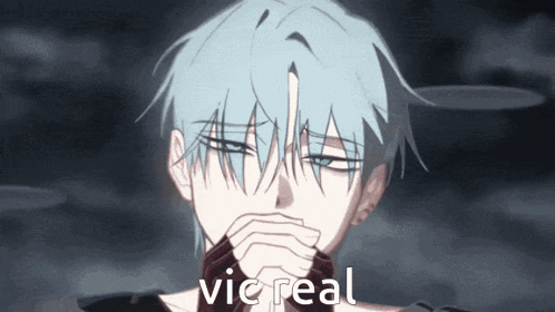 a man with blue hair is covering his mouth with his hands and the word vic real is on the bottom right