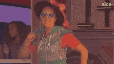 a blurred image of a person wearing sunglasses and headphones with the nick logo in the corner