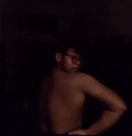 a man 's back is shown in a blurry photo .