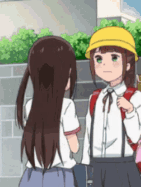 two anime girls are standing next to each other and one is wearing a yellow hat