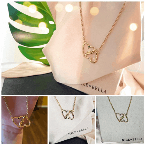 a nice & bella necklace is displayed on a white cloth