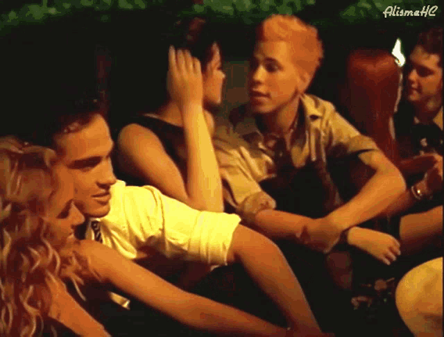 a group of people are sitting in a dark room with the words alimath2 on the bottom