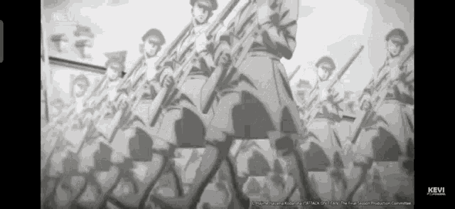 a group of soldiers are marching in a line holding guns in a black and white photo .