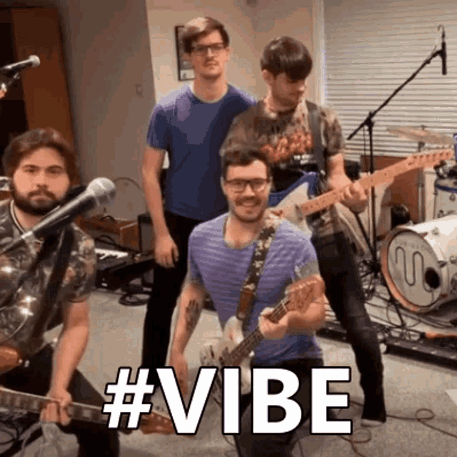 a group of men are playing guitars and singing in front of a drum set with the words #vibe visible
