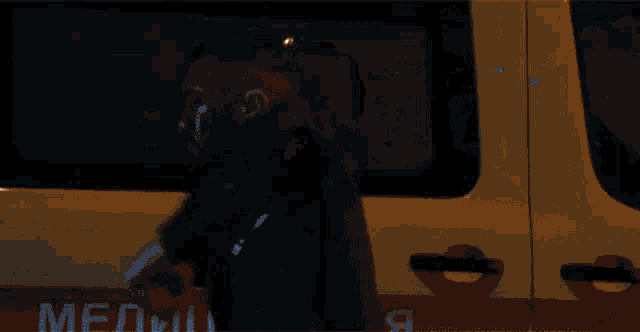 a man with a beard is smoking a cigarette in front of a microwave