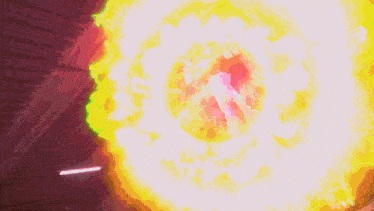 a colorful explosion with a purple and green glow