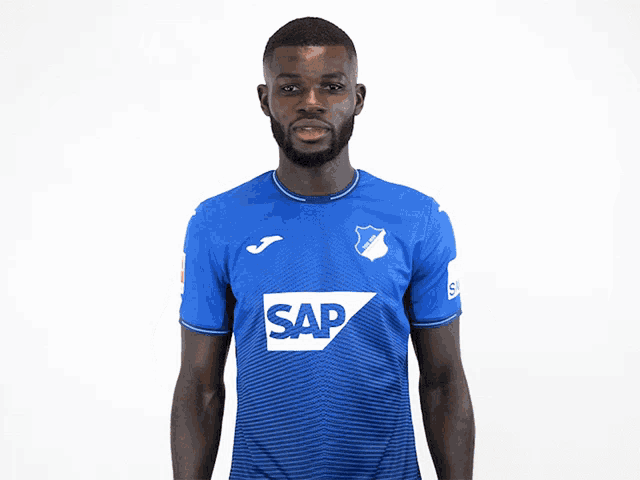 a man is wearing a blue shirt with the word sap on it