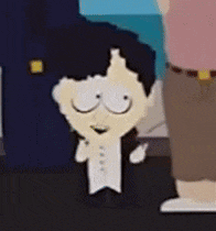 a cartoon character from south park is wearing a tuxedo and standing next to a man in a pink shirt .
