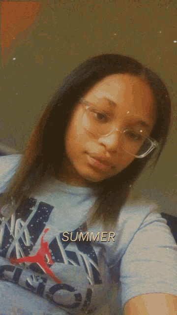 a girl wearing a blue shirt that says summer on it