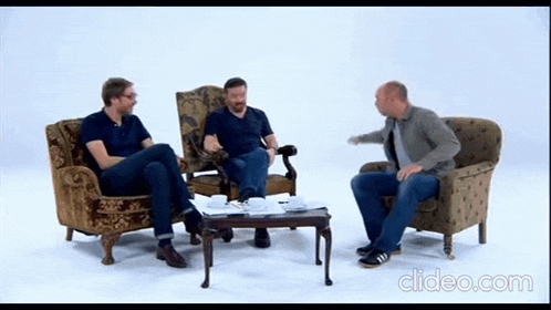a video of three men sitting around a table with clideo.com written on the bottom