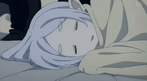 a person is touching a girl 's forehead while she sleeps