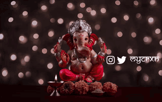 a picture of a statue of a deity with a twitter and instagram logo below it