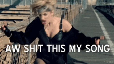 a woman is dancing on a bridge with the words aw shit this my song above her