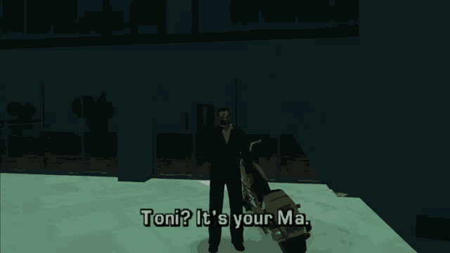 a man in a suit is standing next to a motorcycle and says " toni "