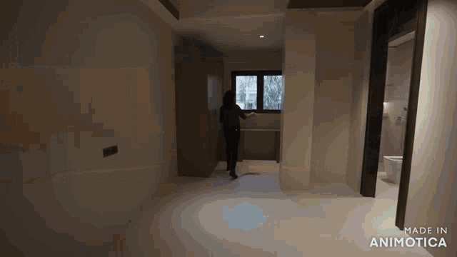 a video of a woman walking through a hallway is made in animatica