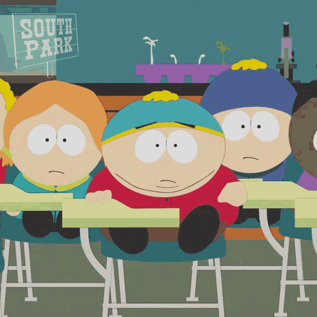 a group of south park characters are sitting at desks in a classroom