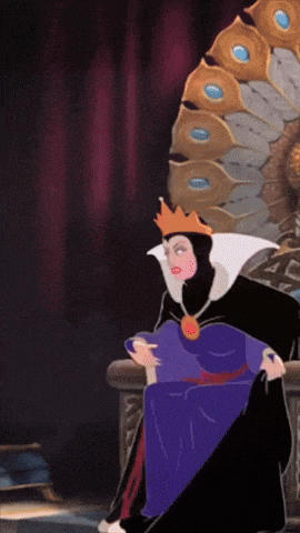 evil queen from snow white and the seven dwarfs is sitting on a throne